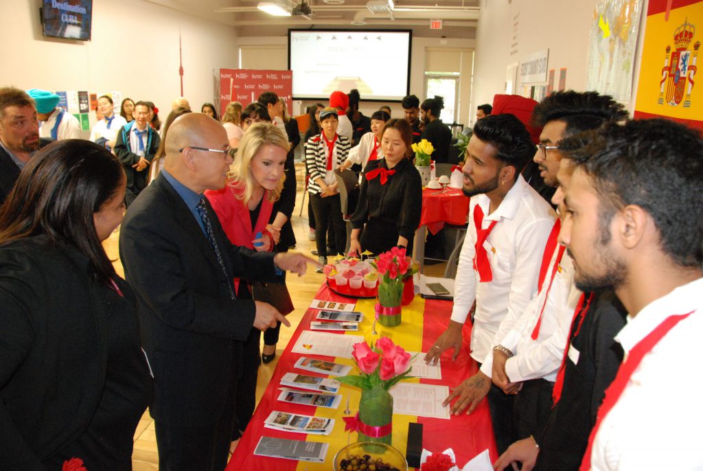 Provincial MPP Vincent Ke talking with student presenters