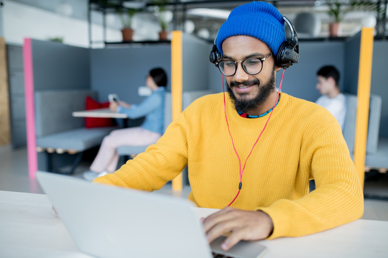 Satisfied app developer working in open space office