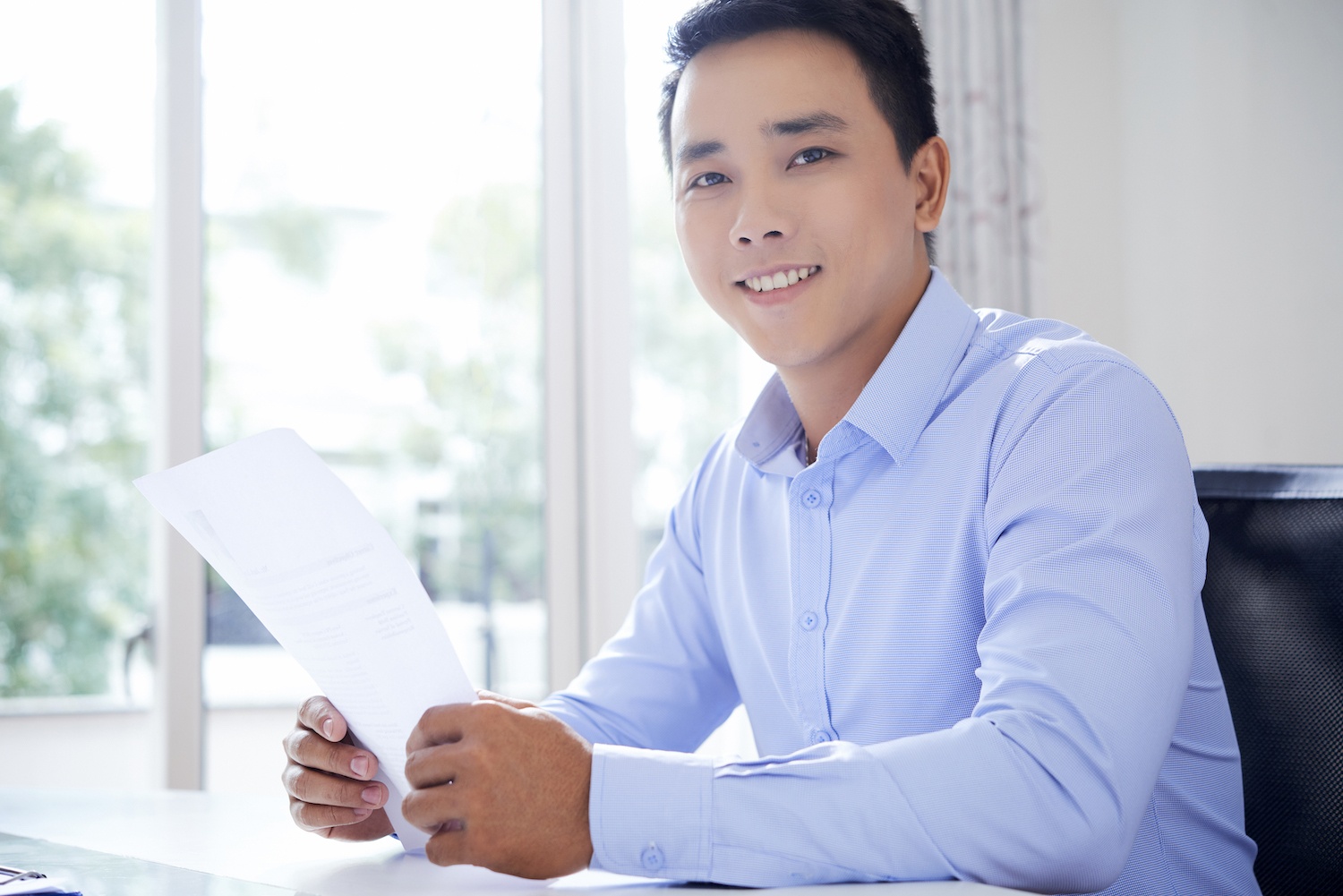 Young entrepreneur with document