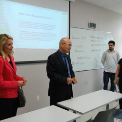 Vincent Ke and Sarah Fischer presenting to students in a classroom at Hanson College